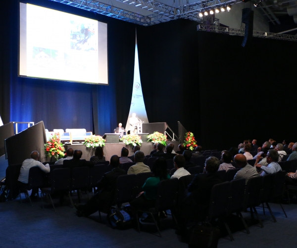 An audience listening to a keynote speaker at a Safer roads conference