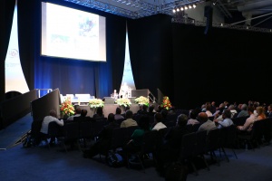 An audience listening to a keynote speaker at a Safer roads conference