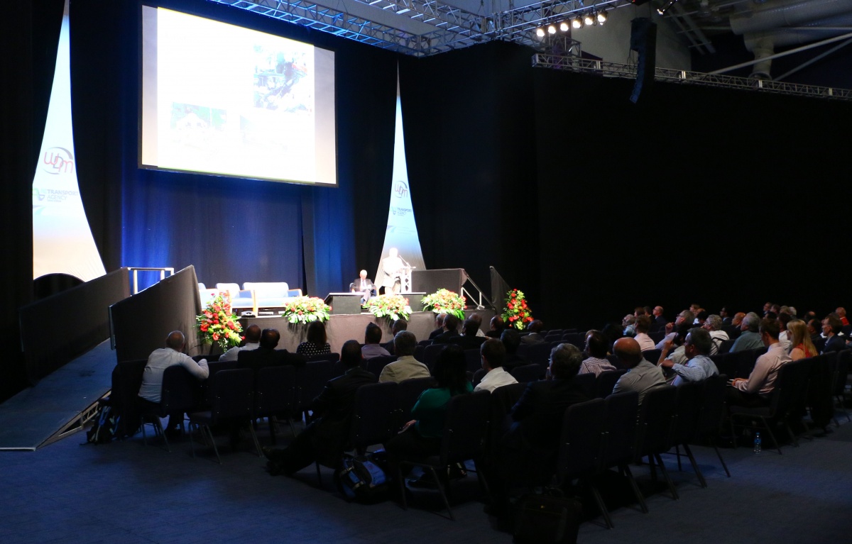 An audience listening to a keynote speaker at a Safer roads conference