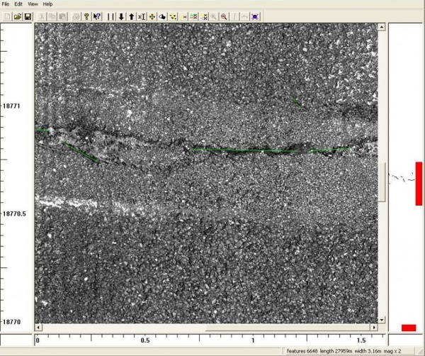 A road crack being analysed using WDM USA consultancy asset management system